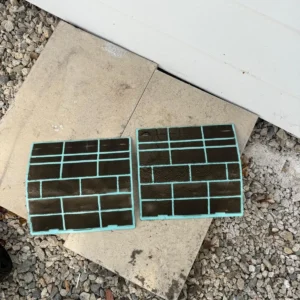 HVAC air filters heavily loaded with dust before cleaning