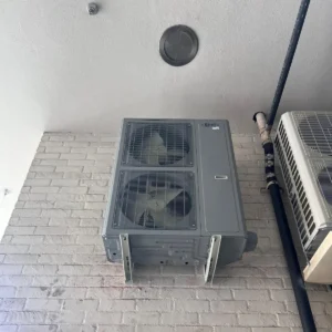 Wall-mounted packaged heating and cooling unit